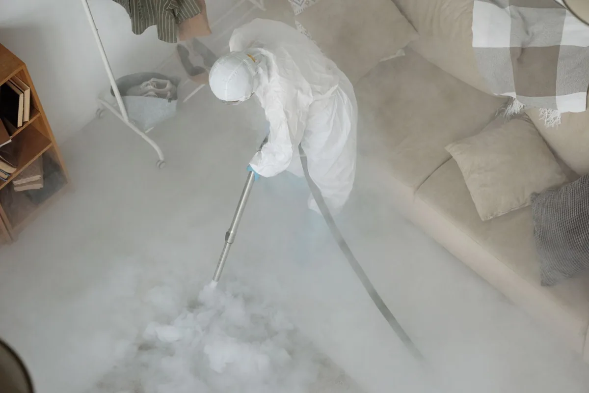 Biohazard cleanup technician in protective equipment, Cleves, OH